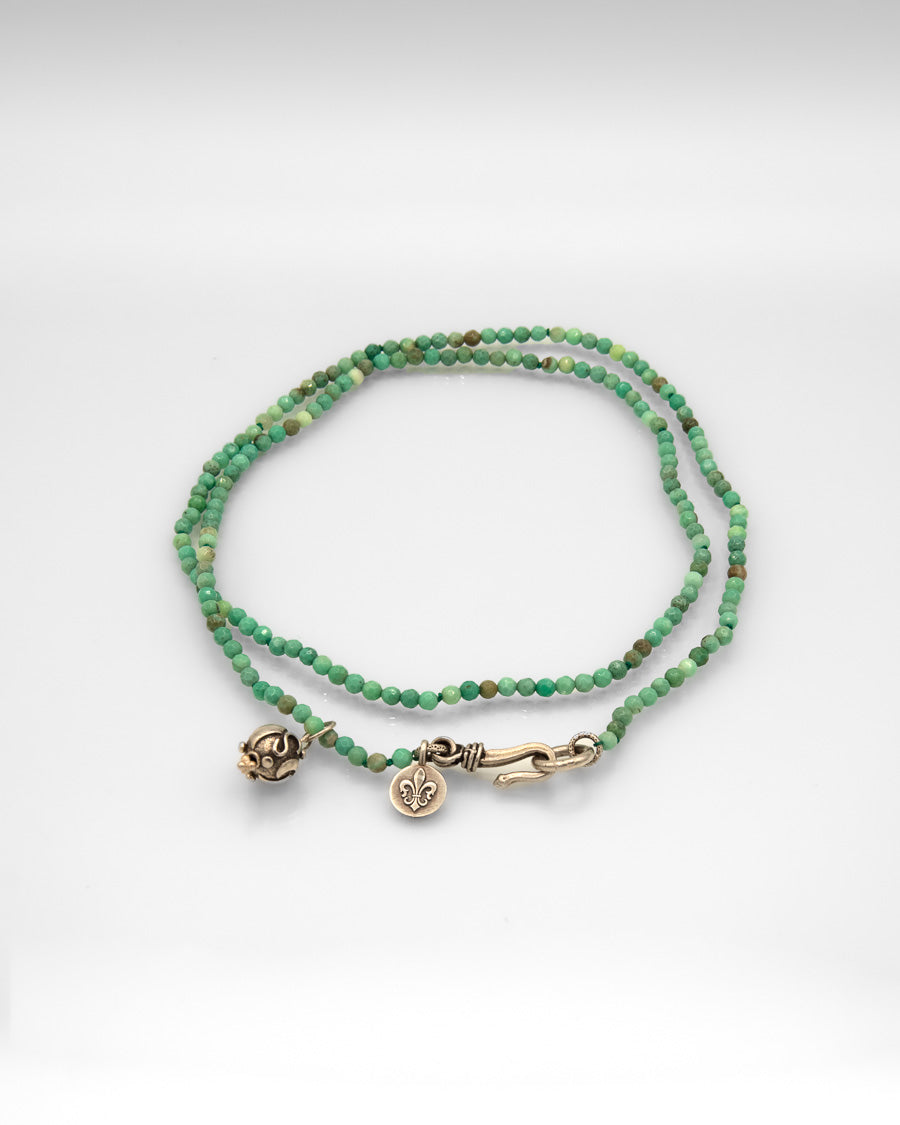 Faceted Turquoise Bead Necklace with Stars Sun and Moon Charm